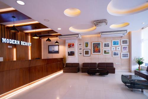 a lobby of a hospital with couches and a waiting room at Modern Resort in Cox's Bazar