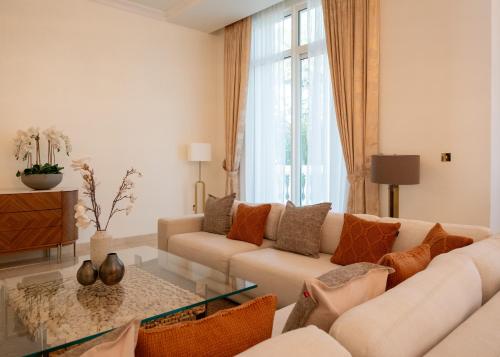 a living room with a couch and a glass table at Kempinski Hotel & Residences Palm Jumeirah in Dubai