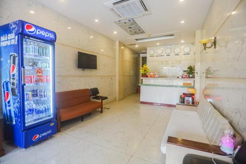 a room with a soda machine in a restaurant at Song Anh 3 Hotel in Ho Chi Minh City