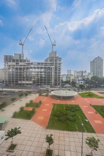 a city with a building with cranes in the background at Song Anh 3 Hotel in Ho Chi Minh City