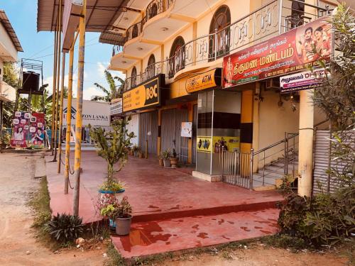 an empty street in front of a building at Nallur Mylooran Arangam in Jaffna