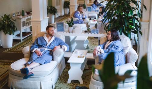 a group of people sitting in chairs in a salon at Omni Bedford Springs Resort & Spa in Bedford