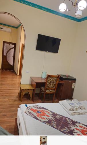 Ένα ή περισσότερα κρεβάτια σε δωμάτιο στο ESHONI PIR Boutique