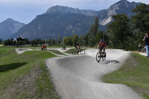a group of people riding bikes down a dirt road at Ferienwohnung Achenrain 1 in Kramsach