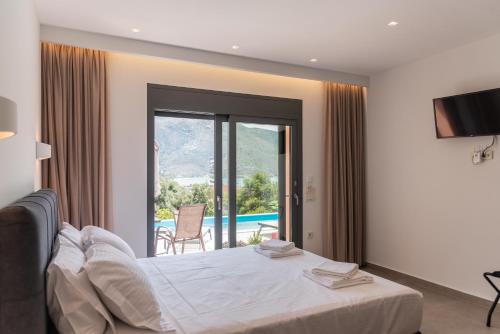 a bedroom with a bed and a view of a pool at IL Mare Plataria in Igoumenitsa