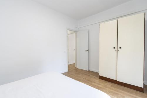 a room with white cabinets and a mirror at Casa Olegari in Almacellas