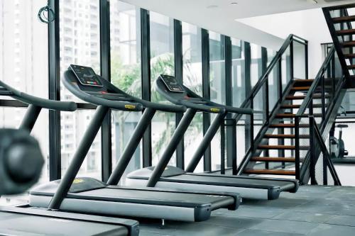 a row of treadmills in a gym at Urban Suites George Town in Jelutong