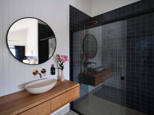 a bathroom with a sink and a mirror at Shawwood Estate in Mudgee