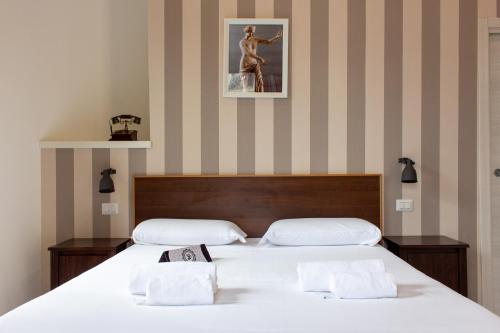 a bedroom with two beds and a picture on the wall at B&B Sweet Sleep in Naples