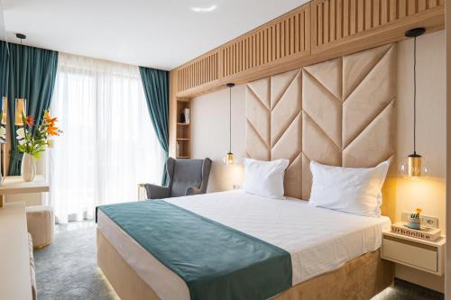 Кровать или кровати в номере Harmony Suites Grand Resort