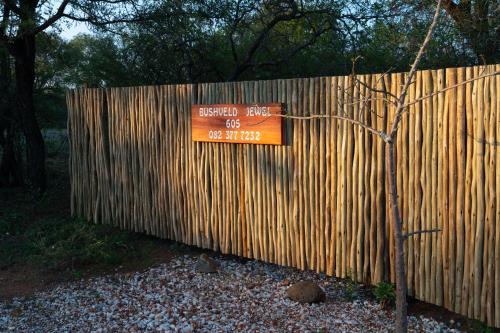 a wooden fence with a sign on it at Bushveld Jewel - Close to Kruger in Hoedspruit