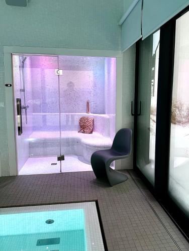 a bathroom with a shower and a bath tub at villa relax with swimming pool and mountain view in Buków