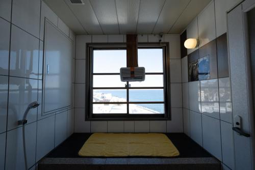 a small room with a window in a bathroom at LiVEMAX RESORT Shiretoko Sea Front in Rausu