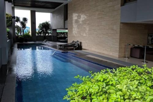 The swimming pool at or close to Across Greenbelt! Studio Condo 1 bedroom