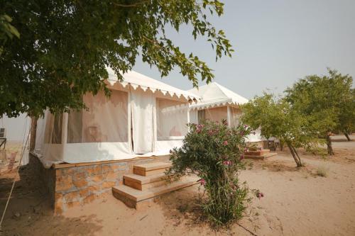 a house with stairs in front of it at Prince Desert Camp in Sām