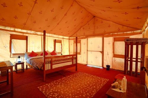 a bedroom with a bed in a tent at Prince Desert Camp in Sām