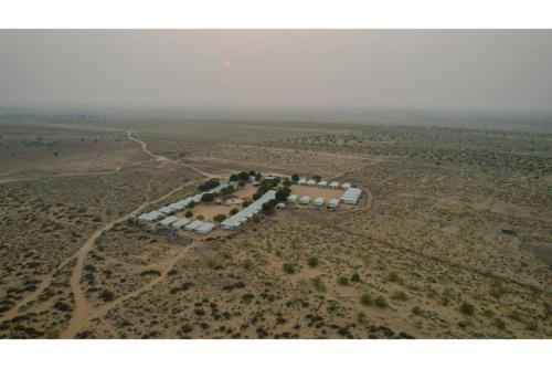 an aerial view of a house in the desert at Prince Desert Camp in Sām