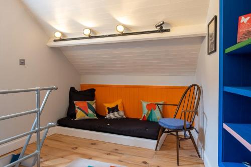 a room with a bed and a chair at 1960s Inspired City Centre Apartment for 4 with Parking in Norwich