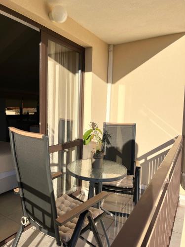 a table and chairs on a balcony with a table at Apartment Josipa in Vela Luka