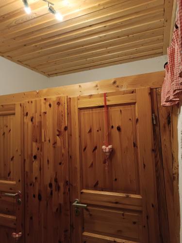 a room with wood paneled walls and a ceiling at Erlebnisreiterhof Wolferstadt 