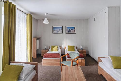 A bed or beds in a room at OW Jaskółka