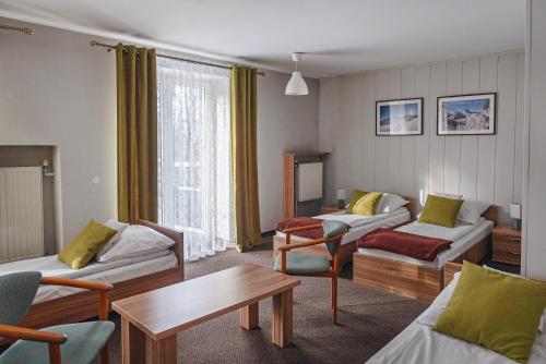 Llit o llits en una habitació de OW Jaskółka
