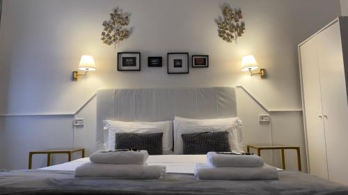 a bedroom with a bed with two pillows on it at Suitedream Vatican in Rome