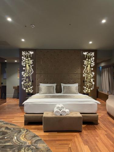 a bedroom with a large bed in a room at Arka Art Hotel in Tirana