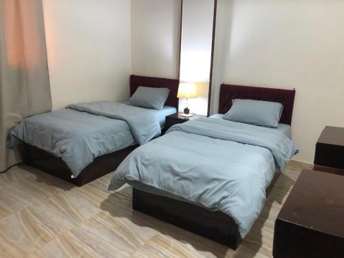 Ένα ή περισσότερα κρεβάτια σε δωμάτιο στο Lady Queen Apartment