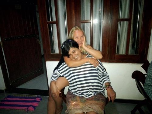 a woman sitting on the back of a man at Royal Inside Hotel in Udawalawe