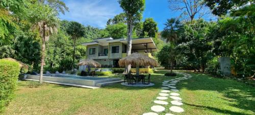 a house with a swimming pool in the yard at Lazy Republique in Ko Chang