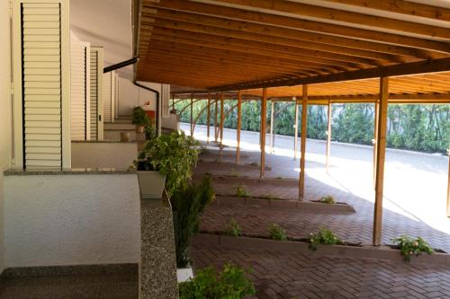 a pavilion with stairs and plants in a building at Hotel Motel 2000 in Trezzano sul Naviglio