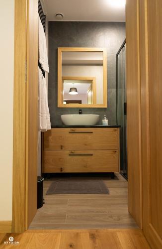 a bathroom with a sink and a mirror at Zarębisko - noclegi całoroczne in Zwierzyniec
