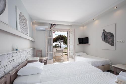 Una cama o camas en una habitación de Kavuras Village Hotel & Suites