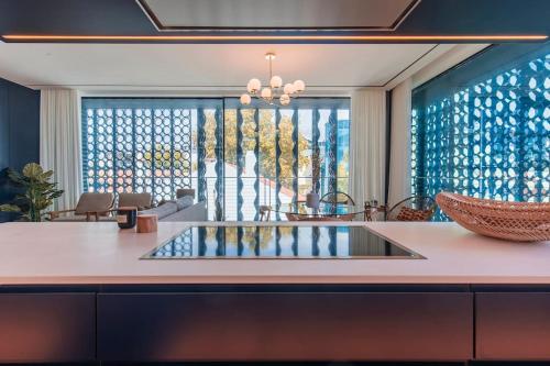 a kitchen with a island with a counter top at New Luxury Central Cascais in Cascais