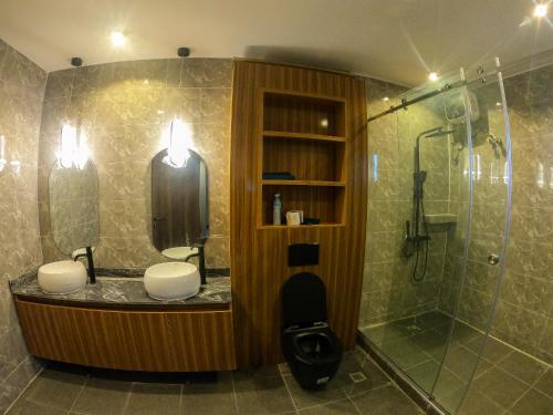 a bathroom with a shower and a sink at Skyloft Suite in Lagos