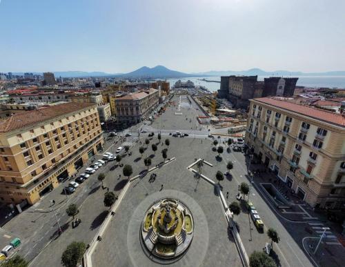 an aerial view of a city with a street at Elegant Flat at Municipio by Napoliapartments in Naples