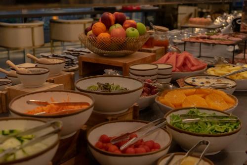 a buffet with bowls of different types of food at BessaHotel Liberdade in Lisbon