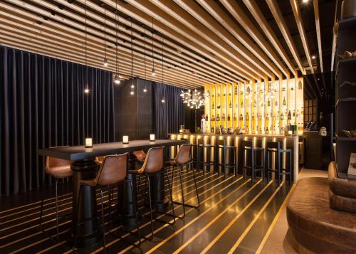 a dining room with a table and some chairs at BessaHotel Liberdade in Lisbon