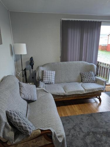 a living room with two couches and a couch at 238b South shore in Bridlington