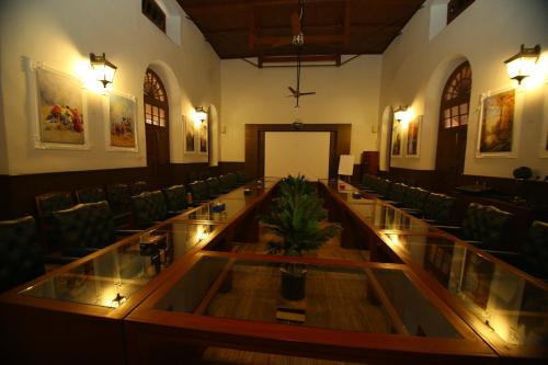 a conference room with a long table and chairs at Peshawar Barracks Hotel Estb-1867 in Peshawar