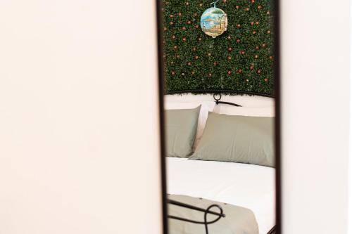 a room with a bed with a christmas tree at beb Da basso experience Napoli Toledo, Pompeii, Ercolano and Vesuvio in San Giorgio a Cremano
