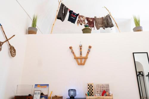 a shelf with clothes hanging on a clothes line at beb Da basso experience Napoli Toledo, Pompeii, Ercolano and Vesuvio in San Giorgio a Cremano