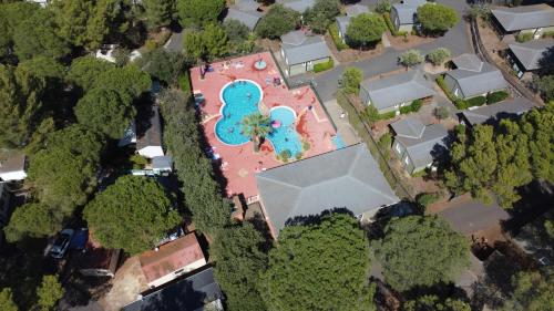 an overhead view of a house with a swimming pool at Cape Agde Charmant chalet sur le Mont Saint Loup in Agde