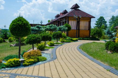 a brick path in front of a house with a building at Europe in Solonka