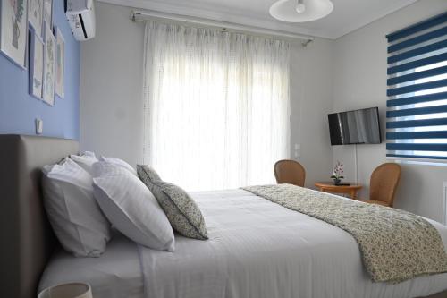 Ένα ή περισσότερα κρεβάτια σε δωμάτιο στο GianAngelo Holiday Villa