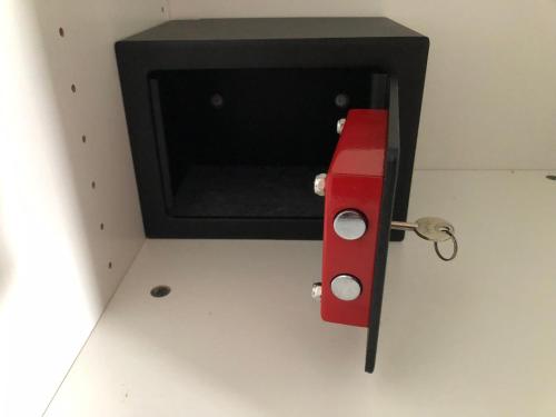 a small door with a red latch in a room at Clare to Spalding character escape in Spalding