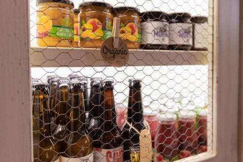 a bunch of bottles of wine on a shelf at Locanda dell'Aioncino in Bibbona