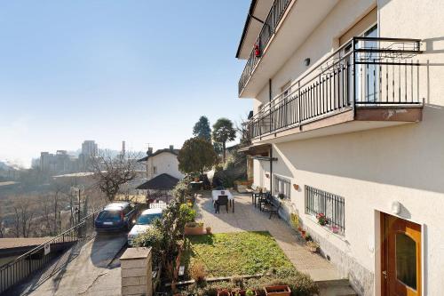 a balcony of a building with cars parked on the street at Casa Bella in Intra