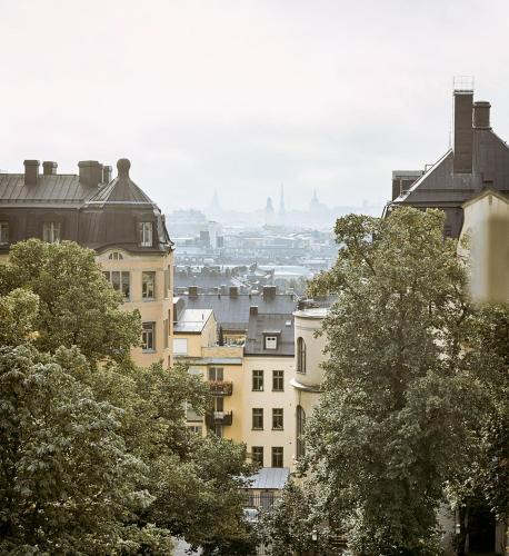 a view of a city with buildings and trees at Villa Dahlia in Stockholm